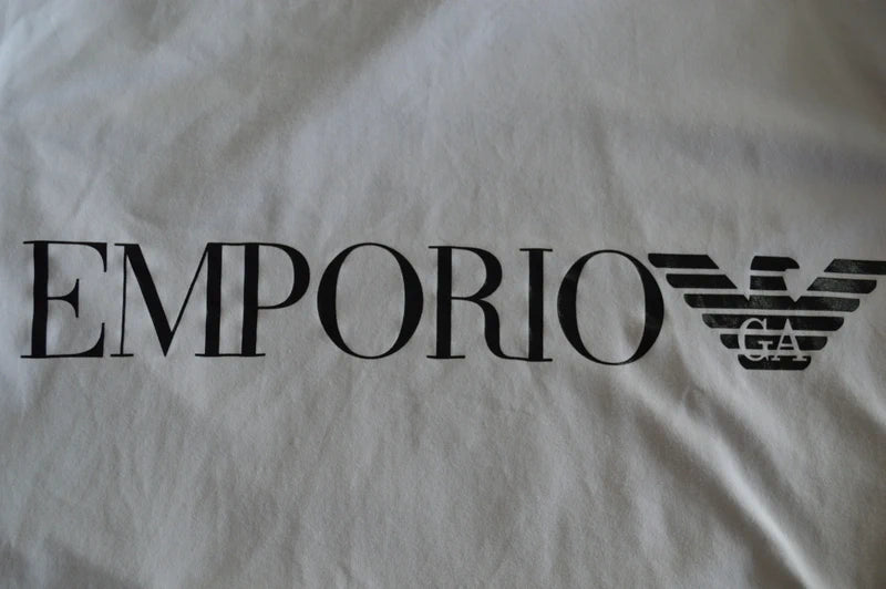 EA7 Emporio Armani – Damen Cropped T-Shirt in Weiß mit Ärmel-Prints – Gr. L (Stark getragen / Defekt- & Bastlerpreis)