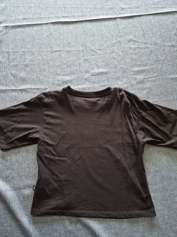PUMA Damen Crop T-Shirt mit Metallic-Logo in Schwarz/Silber – Gr. S