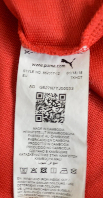 PUMA – Damen Cropped T-Shirt Rebel Tee in Orangerot mit Ärmel-Prints – Gr. S (Sehr guter Zustand)