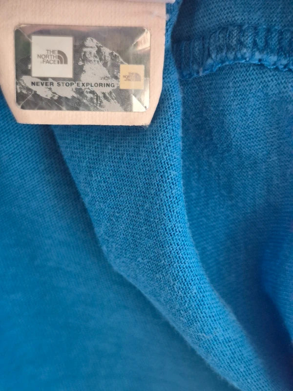 The North Face Herren T-Shirt „Never Stop Exploring“ – Blau – Gr. S (Guter Zustand mit kl. Makel)